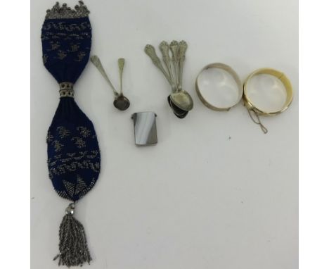 A silver gilt bangle, evening purse, silver bangle, sundry spoons and vesta.