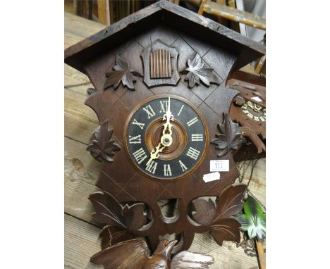 Three 20th Century cuckoo clocks, Acctim modern wall clock and Hermle iron framed wall clock (5).