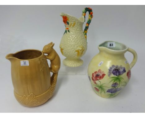 Clarice Cliff Celtic, harvest jug, height 26cm also Radford pottery jug and Sylvac 1959 rabbit jug (3).
