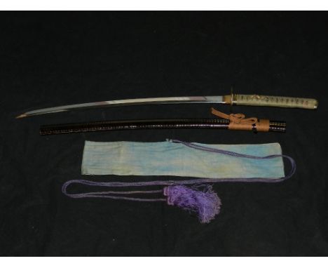 A 19th century Japanese late Edo period katana, with sharkskin handle, bronze and gilt metal fitting, with a later ribbed kos