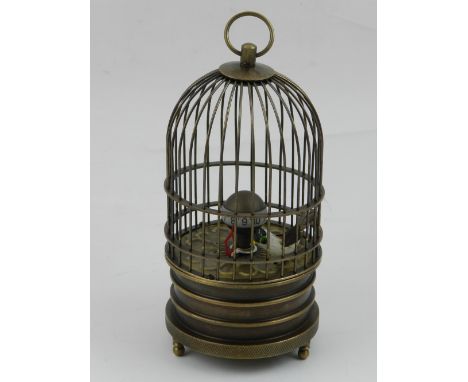 A brass automated bird cage clock. H: 17cm