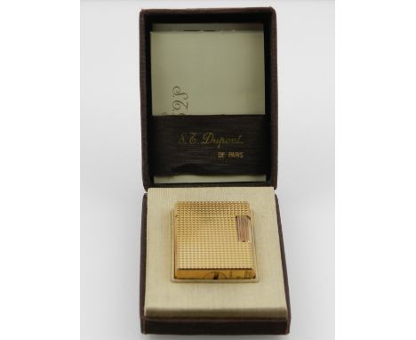 A gilt metal Dupont lighter, boxed. 