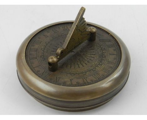 A contemporary brass cased sundial and compass. 