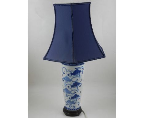 A 20th century Chinese blue and white porcelain vase, decorated with fishes and script, converted into a lamp, mounted on a c