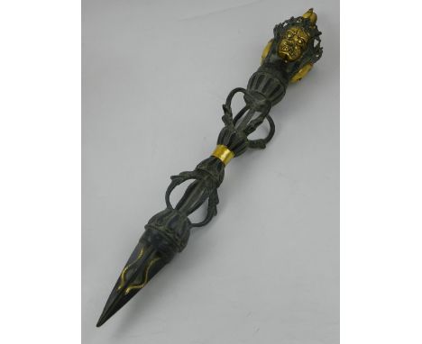 A Tibetan bronze phurba, with gilt heightened decoration. L: 61cm