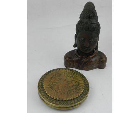 A South East Asian bronze study of Guanyin, the bronze head mounted on hardwood shoulders, together with a polished brass cir