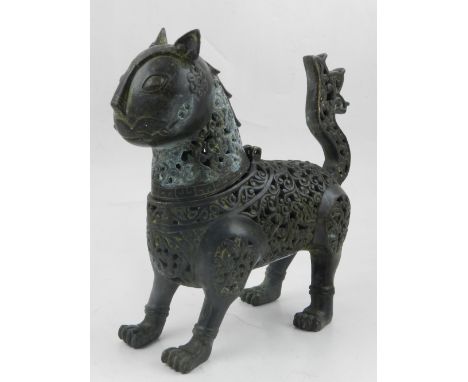 A Chinese bronze incense burner modelled as a mythical animal, having hinged head. L. 20cm