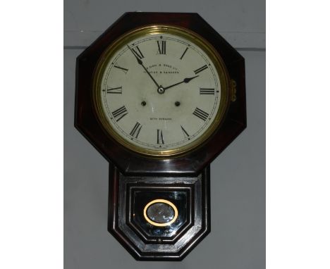 An early 20th century mahogany drop dial wall clock, the octagonal framed cream dial set out in Roman numerals, fited with a 