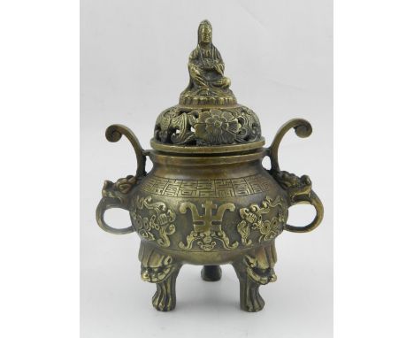 A Japanese bronze koro, having pierced decoration, raised on tripod feet. 