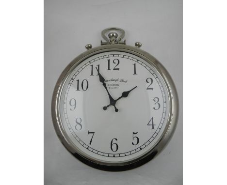 A novelty wall clock in the form of a pocket watch. D: 37cm