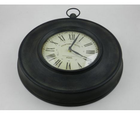 A contemporary circular wall clock. D: 33cm