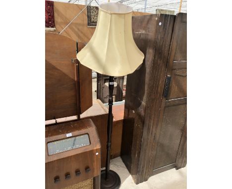 A MAHOGANY STANDARD LAMP WITH SHADE 
