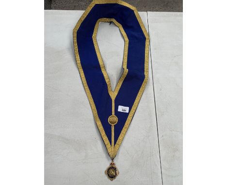 A MANSONIC SASH AND MEDAL 