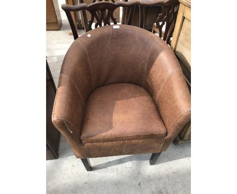 A LIGHT BROWN LEATHER TUB CHAIR 