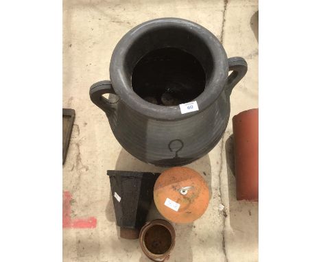 A PLASTIC URN PLANTER, TERRACOTTA BIRD FEEDER, CAST IRON DRAIN TOP AND A MILK CAN 