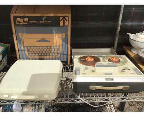 A SMITH CORONA TYPE WRITER AND A PLAYMASTER REEL TO REEL RECORDER 