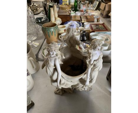 AN ORNATE CERAMIC PLANTER 
