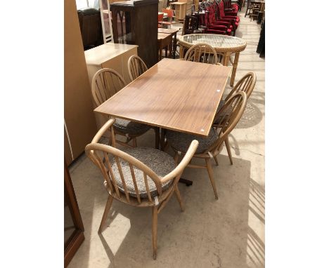 A RETRO DINING TABLE WITH SIX 'ERCOL' LIGHT ELM DINING CHAIRS COMPRISING TWO CARVERS AND FOUR DINING EXAMPLES 