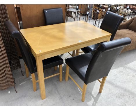 A MODERN LIGHT WOODEN DINING TABLE WITH FOUR BLACK LEATHERETTE DINING CHAIRS 