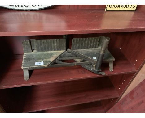 A VINTAGE BRASS AND WOODEN MITRE SAW 