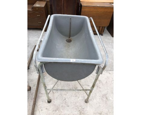 A VINTAGE PLASTIC WATER TROUGH ON METAL FRAME 