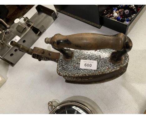 A VINTAGE METAL IRON 