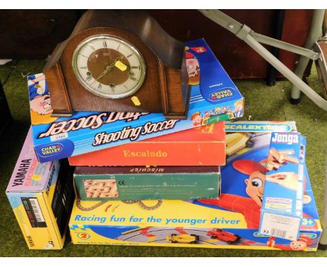 A quantity of games, keyboard and a Smiths Enfield mantel clock.