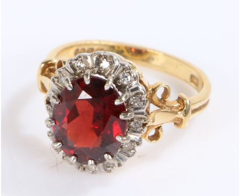 18 carat gold synthetic ruby and diamond set ring, with a central synthetic ruby and diamond surround, 5.8 grams, ring size O