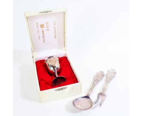 Norwegian silver serving spoon and fork, the handles with cast depictions of a ship, building and skier above "NORGE", stampe
