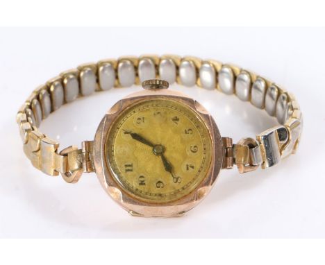 Ladies 9 carat gold wristwatch, the dial with Arabic numerals, manual wound, the case 25mm diameter, on a gilt expanding brac