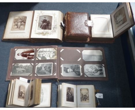 A collection of Victorian leather-bound photograph albums, containing a collection of portrait photographs