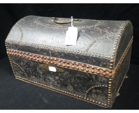 An 18th century black leather and brass dome top travelling trunk