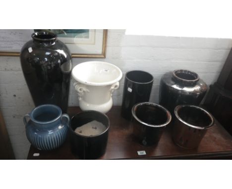 A crackle glazed cream ceramic urn and a collection of pots and jardiniere 