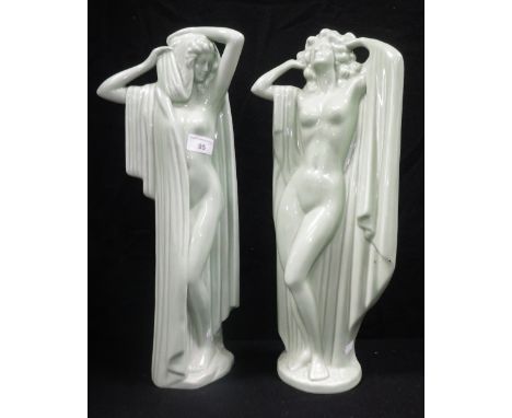 A pair of Art Deco style green glazed ceramic studies of scantily clad women