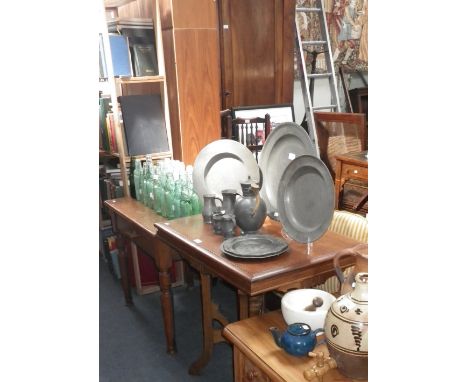 An Edwardian pitch pine student's desk with inset ceramic inkwells and single drawer and a similar Edwardian occasional table