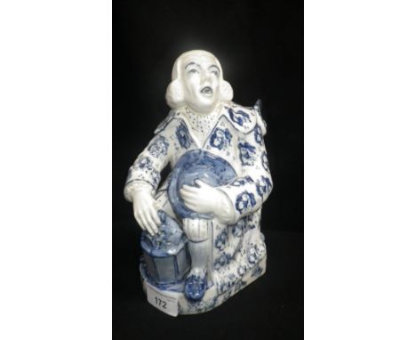 A Staffordshire jug in the form of George Whitfield (preacher) with lantern, decorated in blue sponging, 18th/19th century