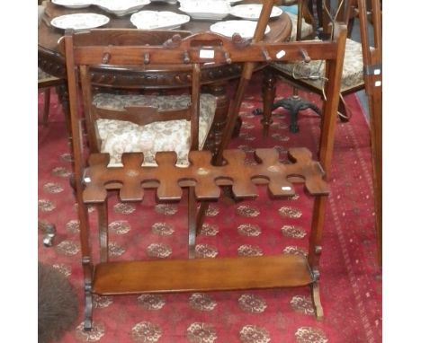 A 19th century mahogany boot and whip rack, 29.5" wide