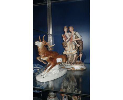 A ceramic figure of two Deer and another