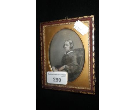 A tinted Daguerreotype portrait of a woman, the case with gilt stamp 'Le Beau, 8 London Terrace, Hackney Road' 