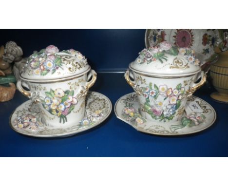 A pair of floral encrusted 'Trembleuse' type covered cups