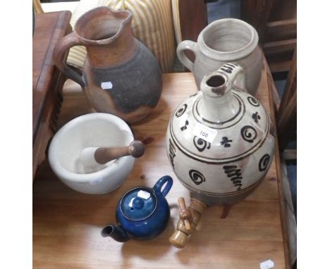 A Verwood pottery jug, a Winchcombe pottery slipware cistern and a collection of similar ceramics