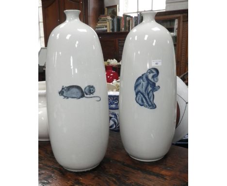 " Jacques De Gheyn by FJ" A pair of contemporary crackle glazed ceramic vases, one decorated with a blue and white monkey, th