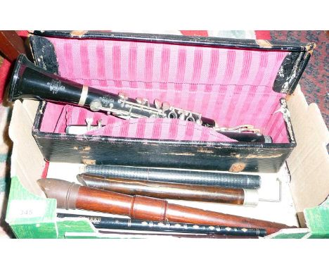 Besson &amp; Co clarinet no 1838 with leather case and other woodwind part instruments with a penny whistle by Clarke