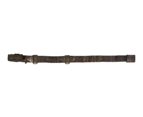 A SAFAVID LEATHER BELT WITH STEEL BUCKLE AND OPENWORK BRASS FITTINGS Safavid Iran, 18th centuryThe thick leather belt featuri