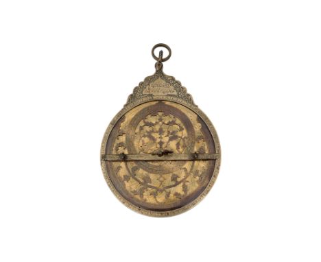 A QAJAR BRASS ASTROLABE WITH FOUR PLATES Possibly Isfahan, Early Qajar Iran, dated 1217 AH (1802 AD)Of typical circular shape