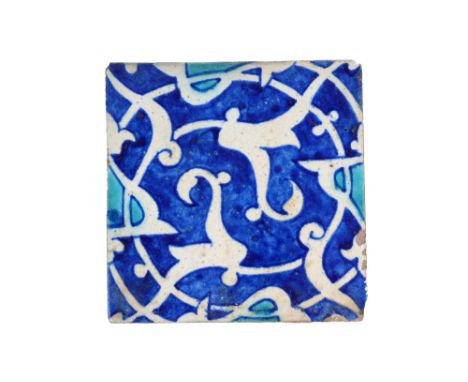 AN INDIAN POTTERY TILE WITH SPLIT PALMETTE SPIRAL Possibly Delhi Sultanates, Northern India or Multan, Sindh, Punjab, 15th - 