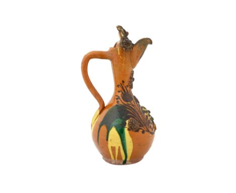 AN ENAMELLED, YELLOW AND GREEN-SPLASHED AMBER-GLAZED CANAKKALE POTTERY EWER Çanakkale, Ottoman Turkey, 19th centuryOf pyrifor