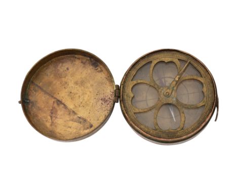 A BRASS QIBLA COMPASS CASE Possibly Iran or Iraq, late 19th – early 20th centuryA circular brass compass case, finely engrave
