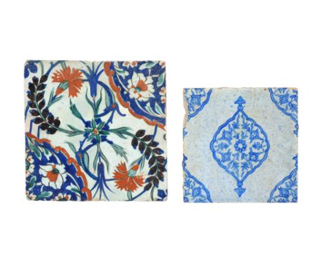 TWO IZNIK-STYLE KUTAHYA POTTERY TILES Ottoman Turkey, 19th centuryComprising a square pottery tile, underglaze-painted in cob