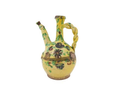 A GOLD-ENAMELLED AND GREEN-SPLASHED YELLOW-GLAZED CANAKKALE POTTERY EWER Çanakkale, Ottoman Turkey, 19th centuryOf globular s